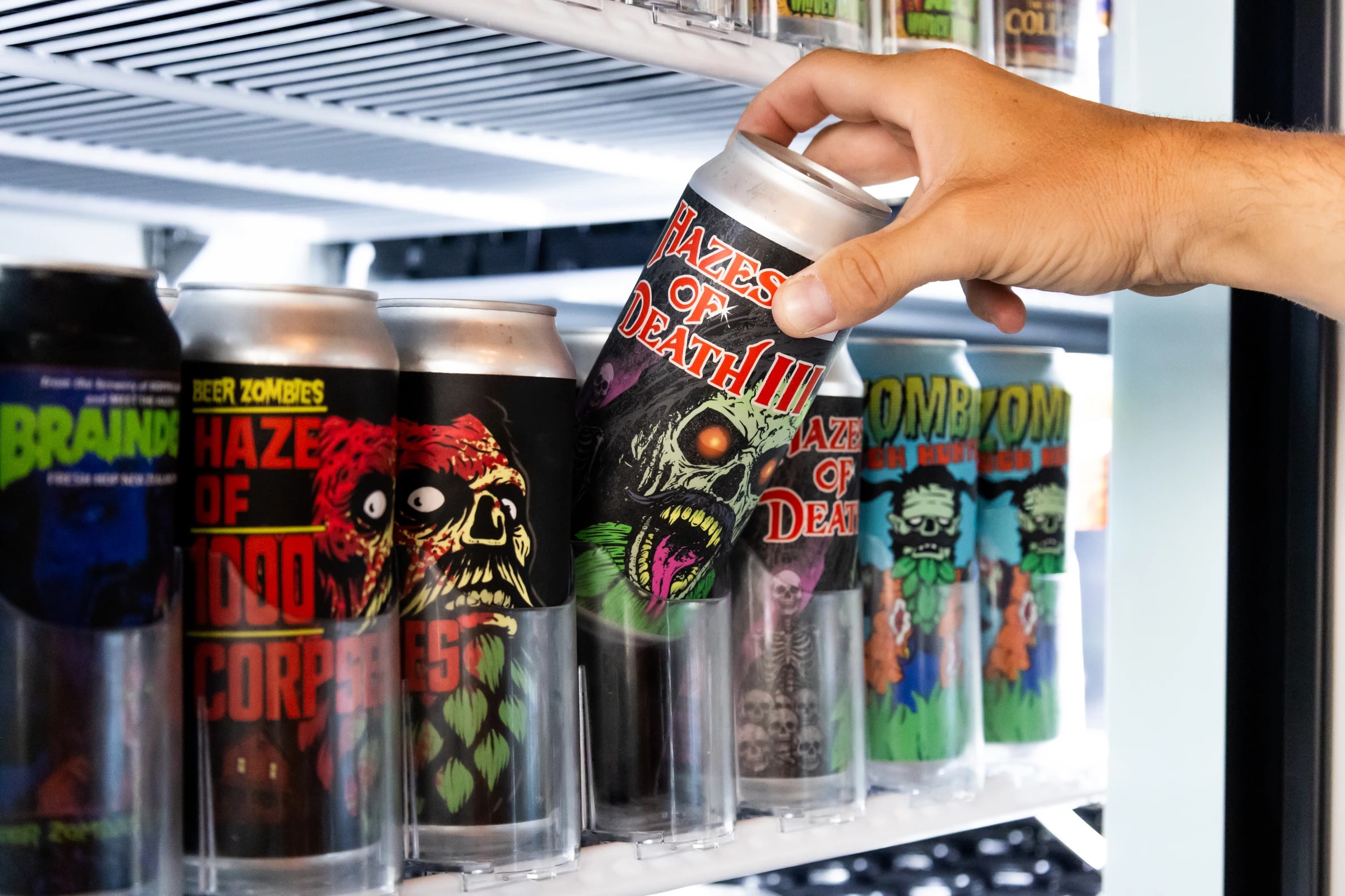 Grabbing a Hazes of Death III from the bottle-shop fridge