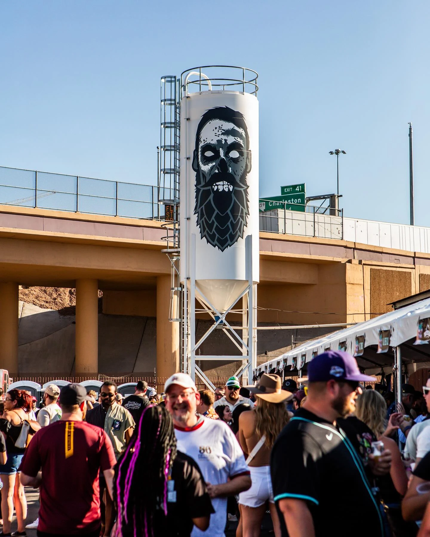 The Beer Zombies grain silo over a packed beer garden