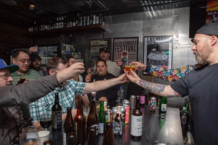 Cheers at the bar of the Beer Zombies Warm Springs draft room
